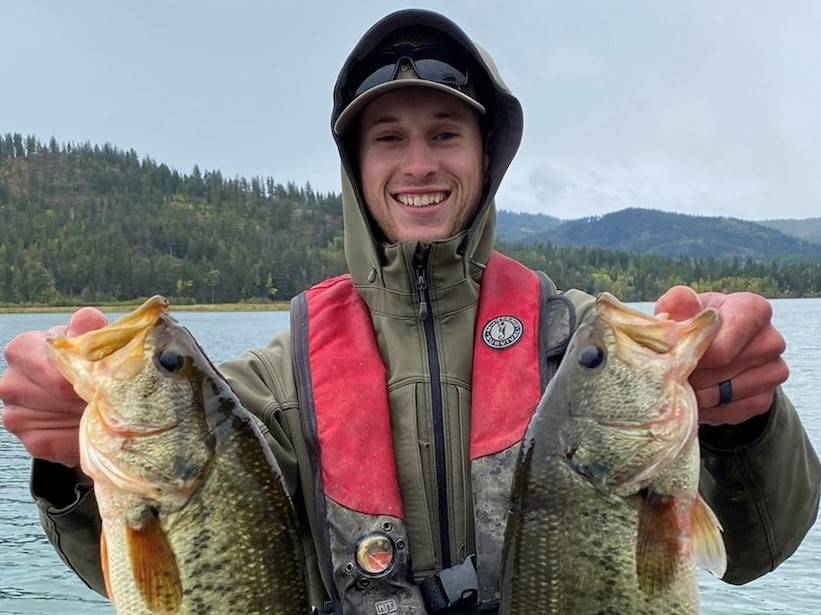 Tyler Hoyt poses with two yellow perch.